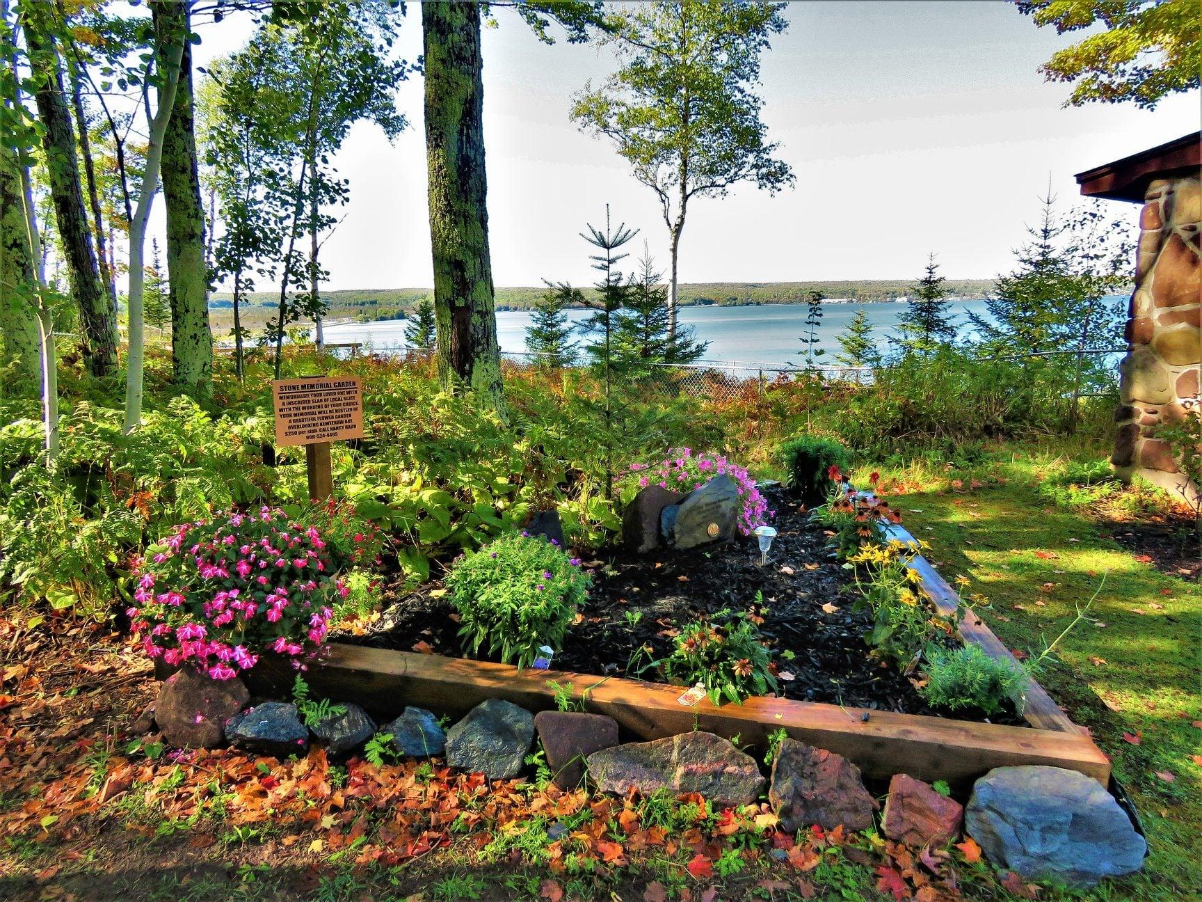 Bishop Baraga Shrine memorial grotto with flowers in the garden. Historic shrines in Michigan’s Upper Peninsula. Bishop Baraga Shrine memorial grotto with flowers in the garden. Historic shrines in Michigan’s Upper Peninsula.
